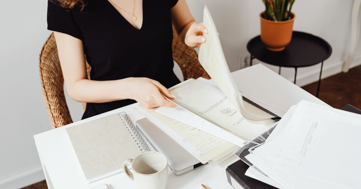 Woman at a table with papers