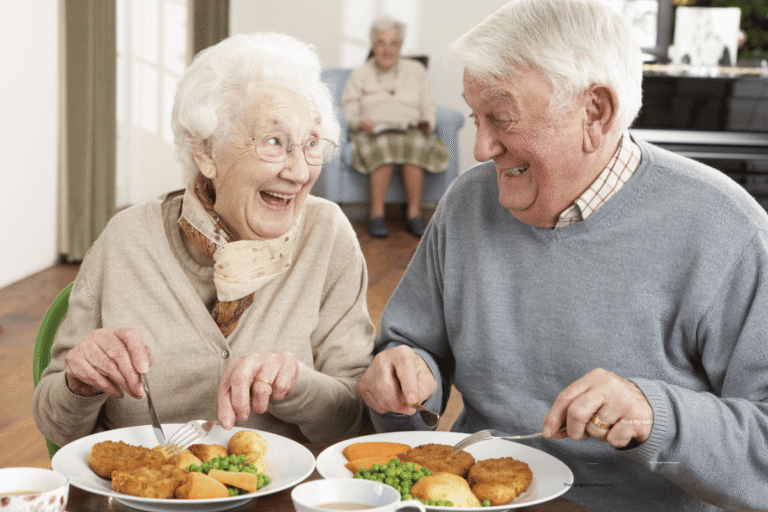 couple sitting down for a meal 768x512